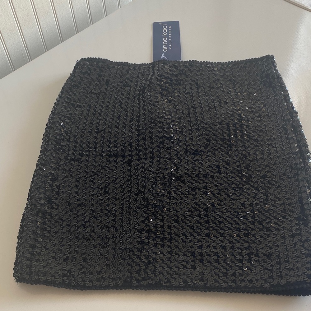 Black Sequin Skirt. NWT from Anna Kaci. Size small. Elastic waist.